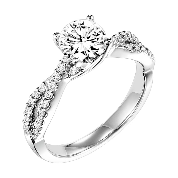 This engagement ring features a diamond prong set band with a delicate twist design elegantly leading up to the round center diamond for an alluring look.  Center Stone is not included.