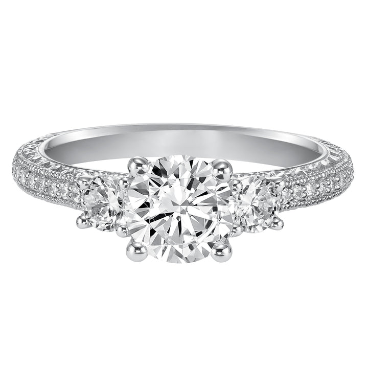 This eye-catching 3-stone engagement sparkles with its diamond prong set band with engraving and milgrain details