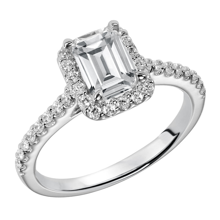 This timeless engagement ring features a diamond exquisitely enhanced with a prong set diamond halo and band