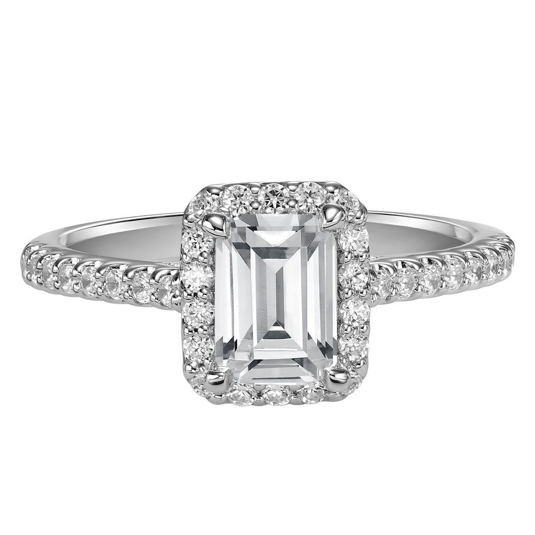 This timeless engagement ring features a diamond exquisitely enhanced with a prong set diamond halo and band