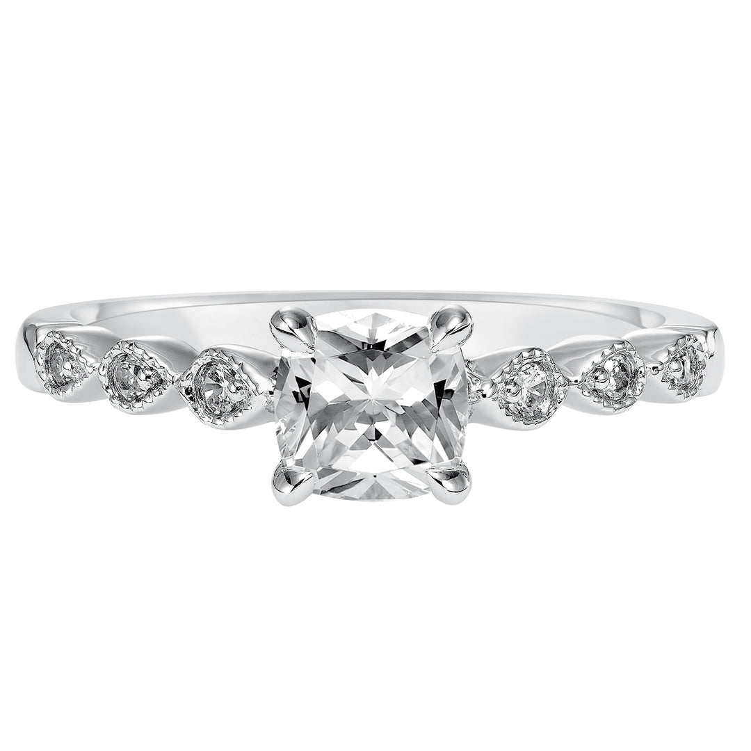 Dazzling with its intricately designed diamond band, this engagement ring is distinct yet enchanting