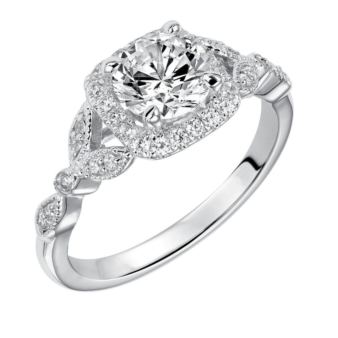 This whimsically styled engagement ring sparkles with its filigree and diamond halo and diamond prong set floral-inspired band