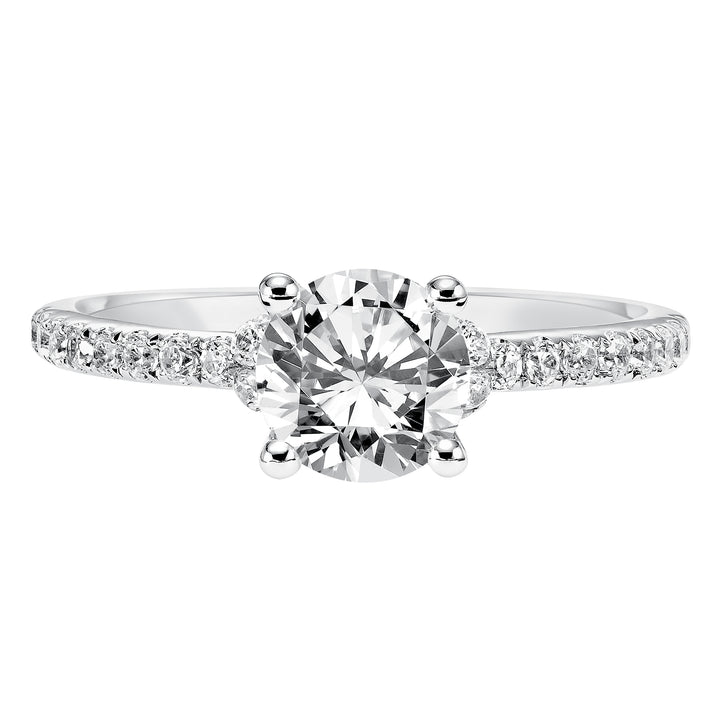 This engagement ring celebrates classic elegance with its delicate diamond prong set band and diamond tiara accent