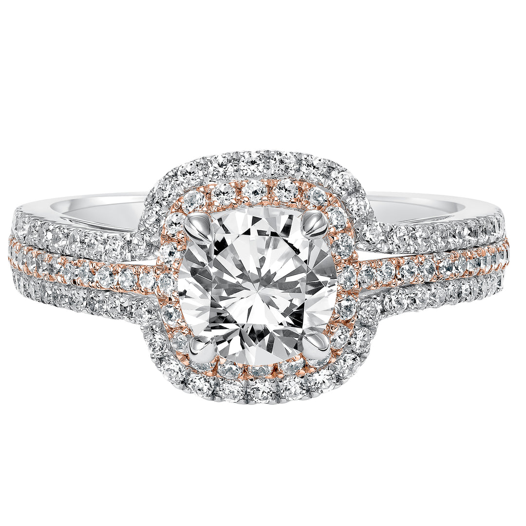 This engagement ring is truly breathtaking featuring both rose and white gold in its prong set diamond double halo and three row band design