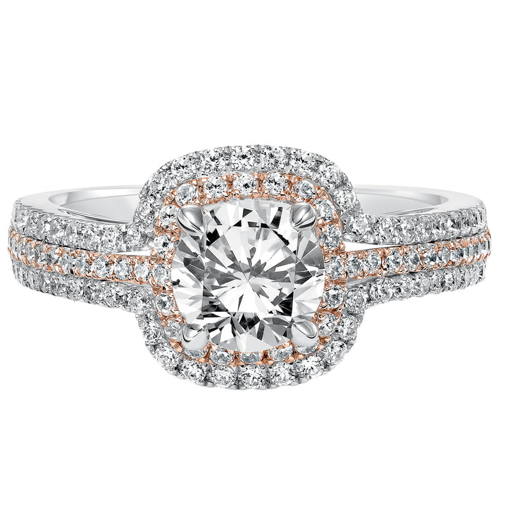 This engagement ring is truly breathtaking featuring both rose and white gold in its prong set diamond double halo and three row band design