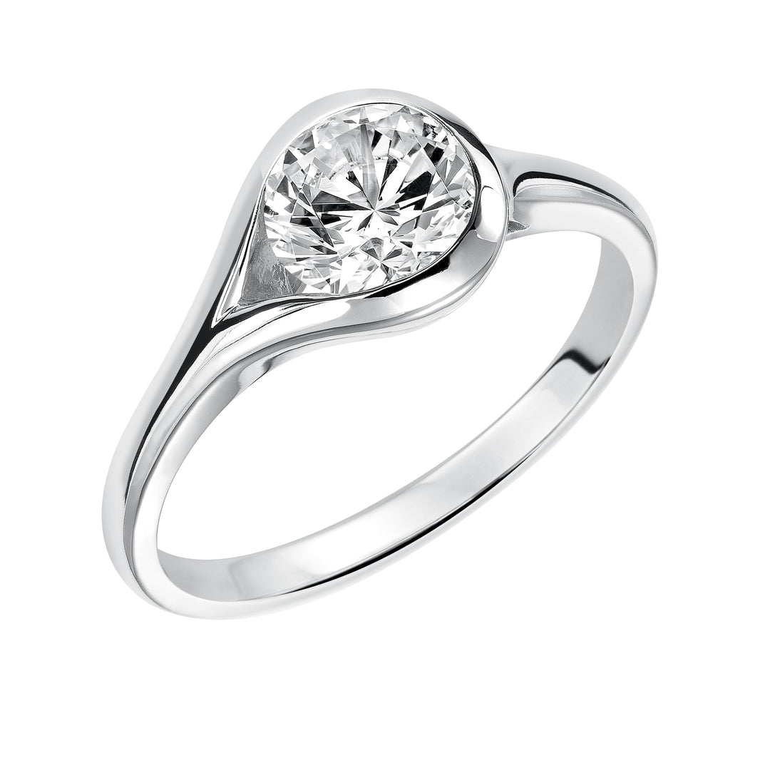 Chic and modern, this engagement ring is set beautifully in a high polished bezel set and bypass designed band