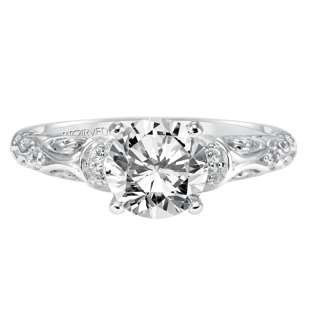 Diamond engagement ring with round center stone and carved diamond enhanced band